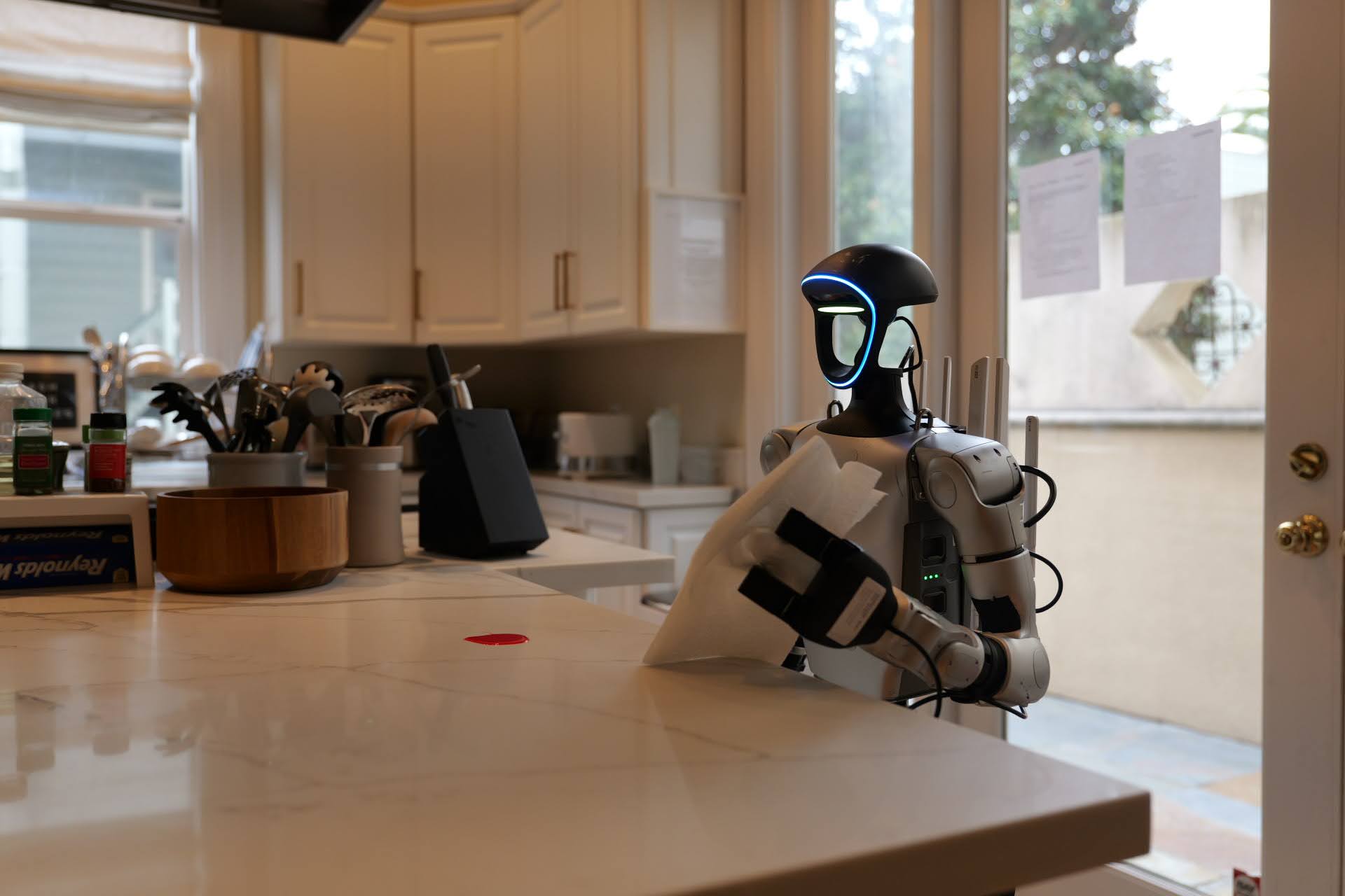 Robot wiping a small spill on a kitchen counter