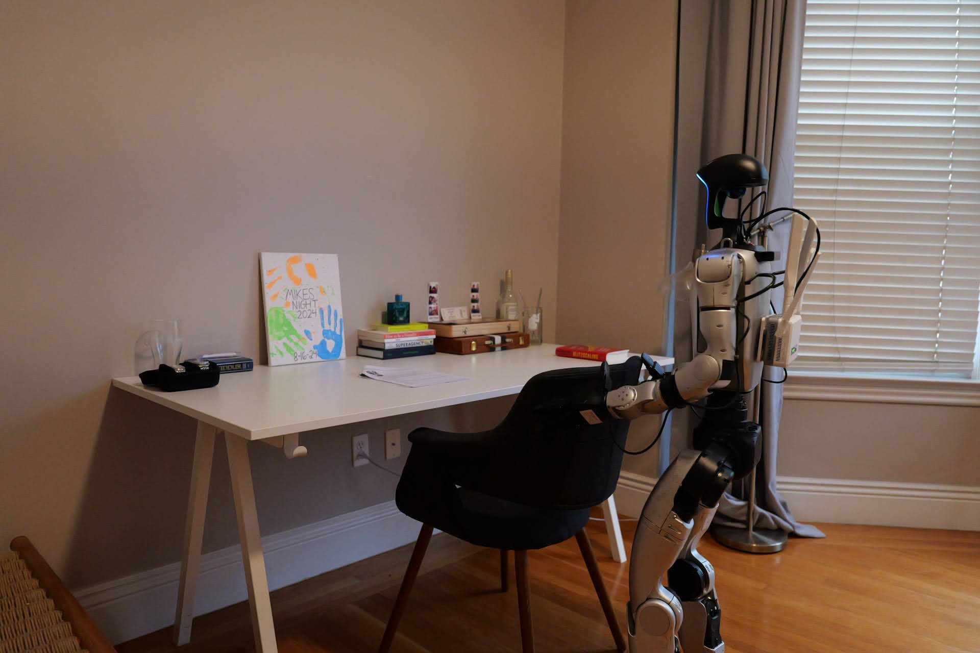 Robot at a desk in a sunlit study